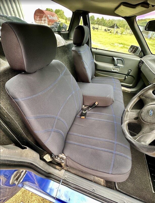 Seat covers fitted to a Ford Falcon