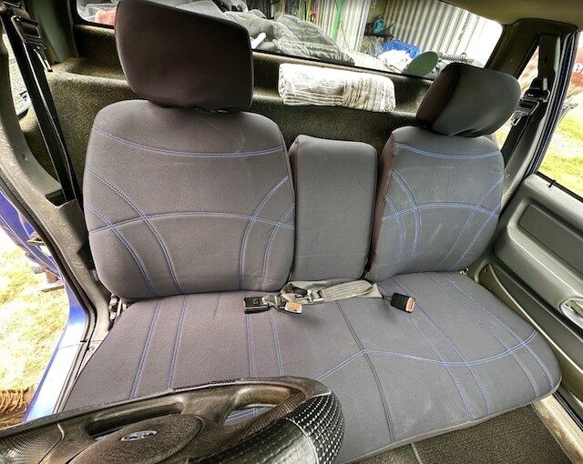 Neoprene seat covers fitted to a Ford Falcon