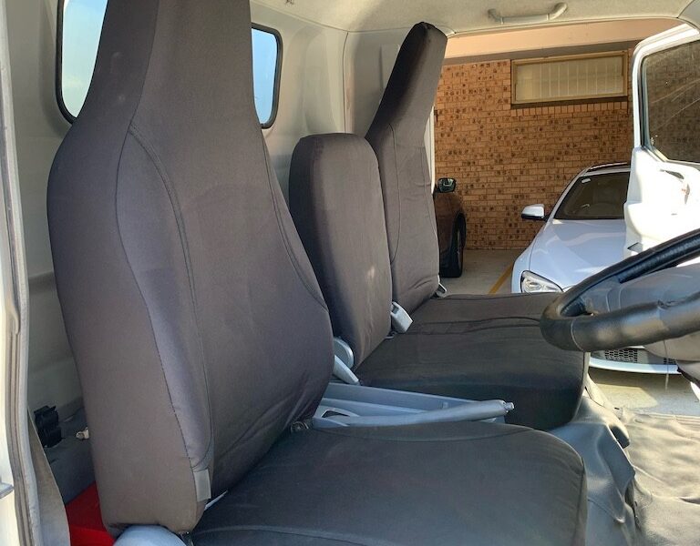 Seat covers fitted to a Mitsubishi Fuso Canter