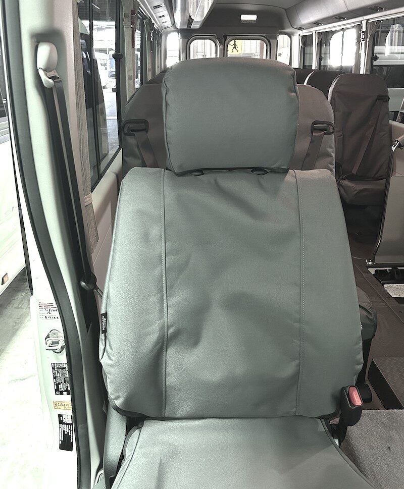 Seat covers fitted to a Toyota Coaster